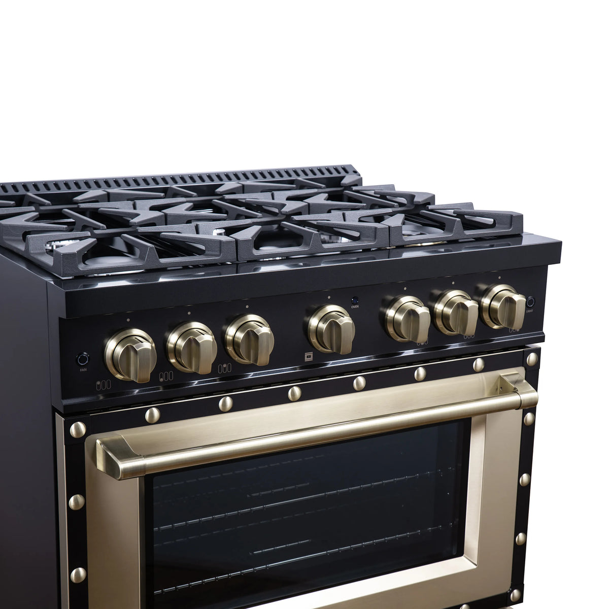 Black dual fuel range cooktop with burner grates, brass knobs, and brass handle