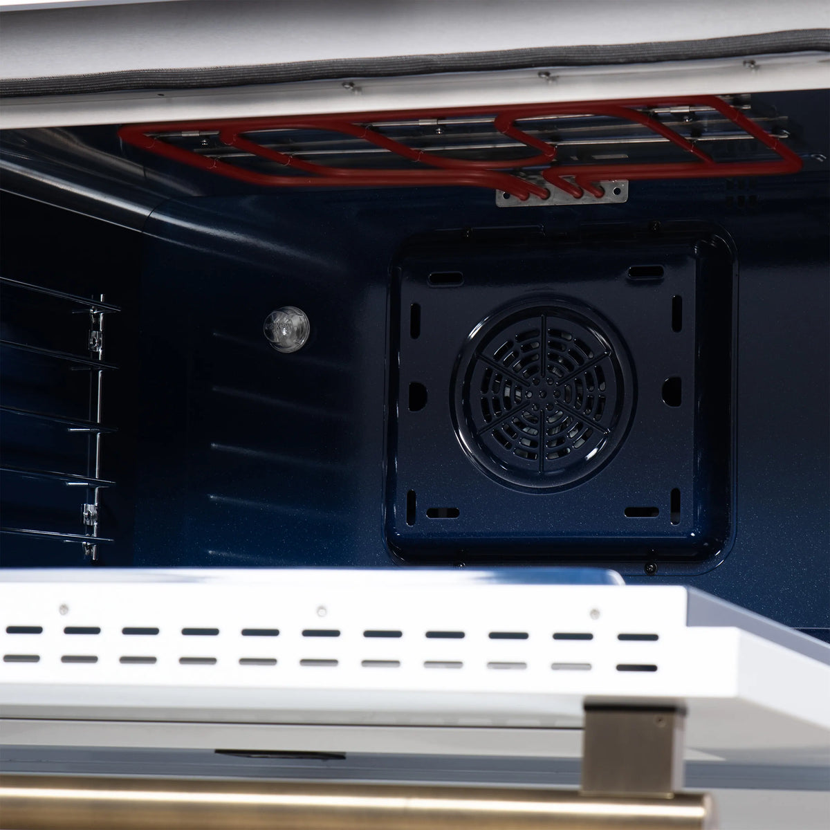 Convection oven rear vent and fan grille inside the range