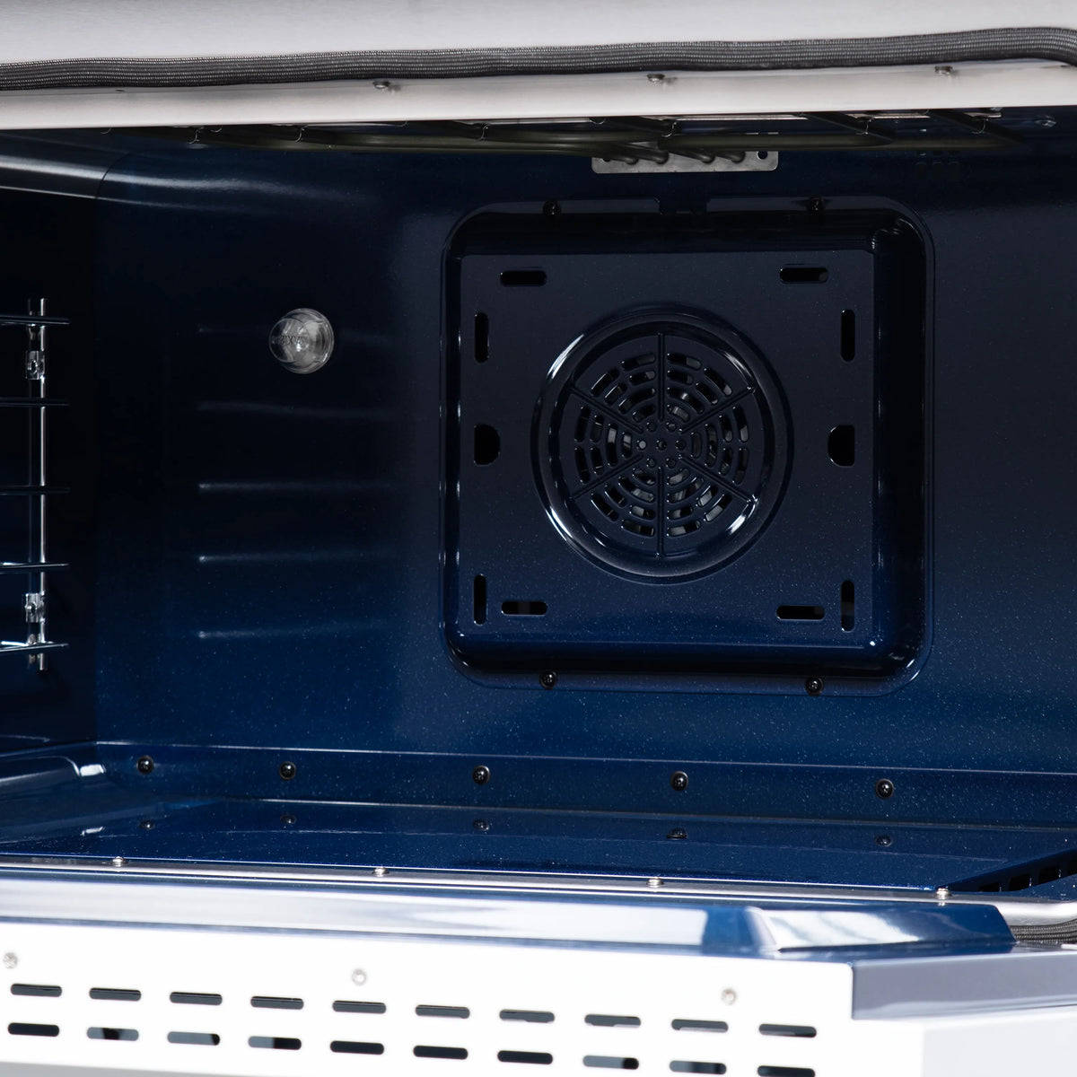 Convection oven rear vent cover and fan grille with surrounding dark panel