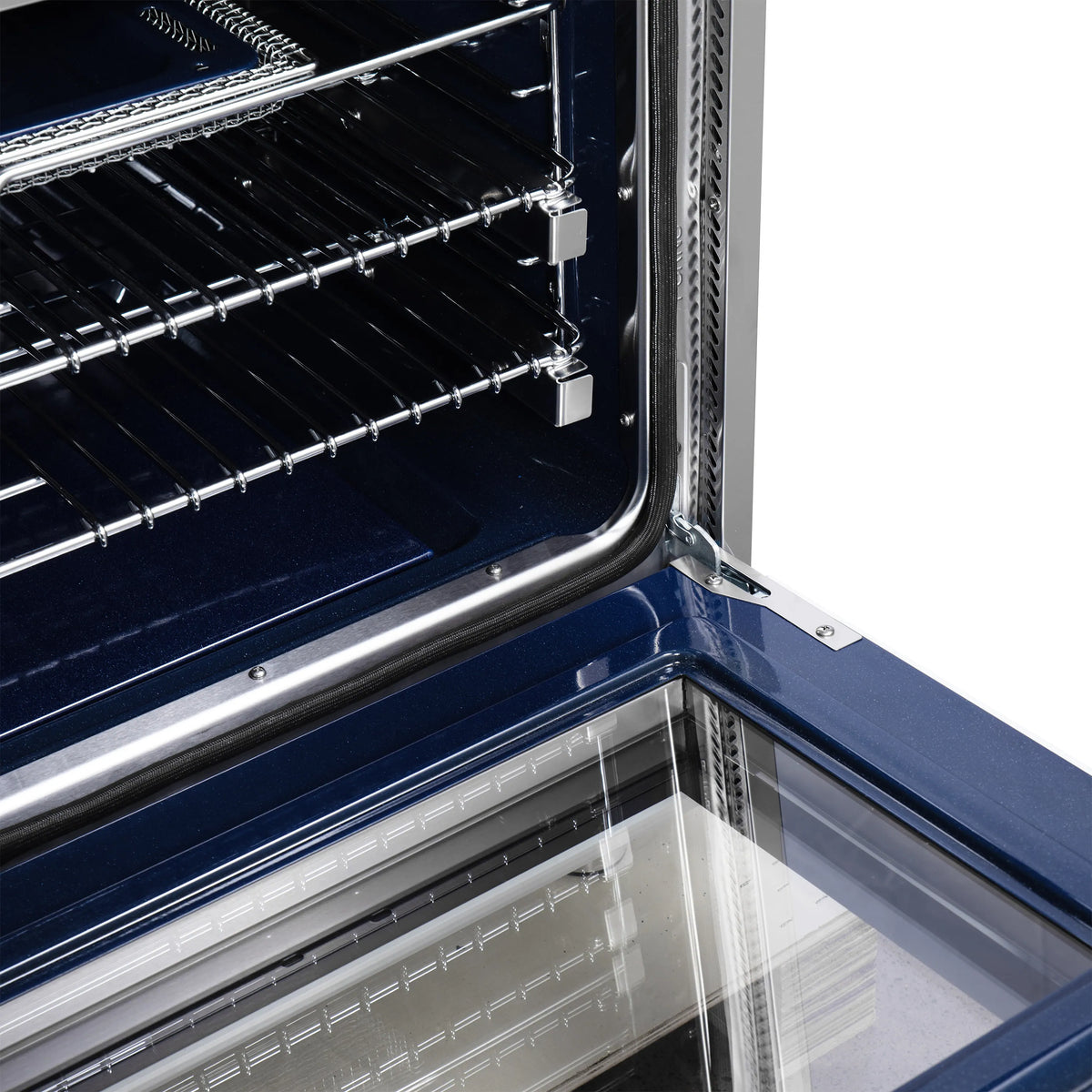 Dual fuel oven interior with upper and lower racks and reflective side wall