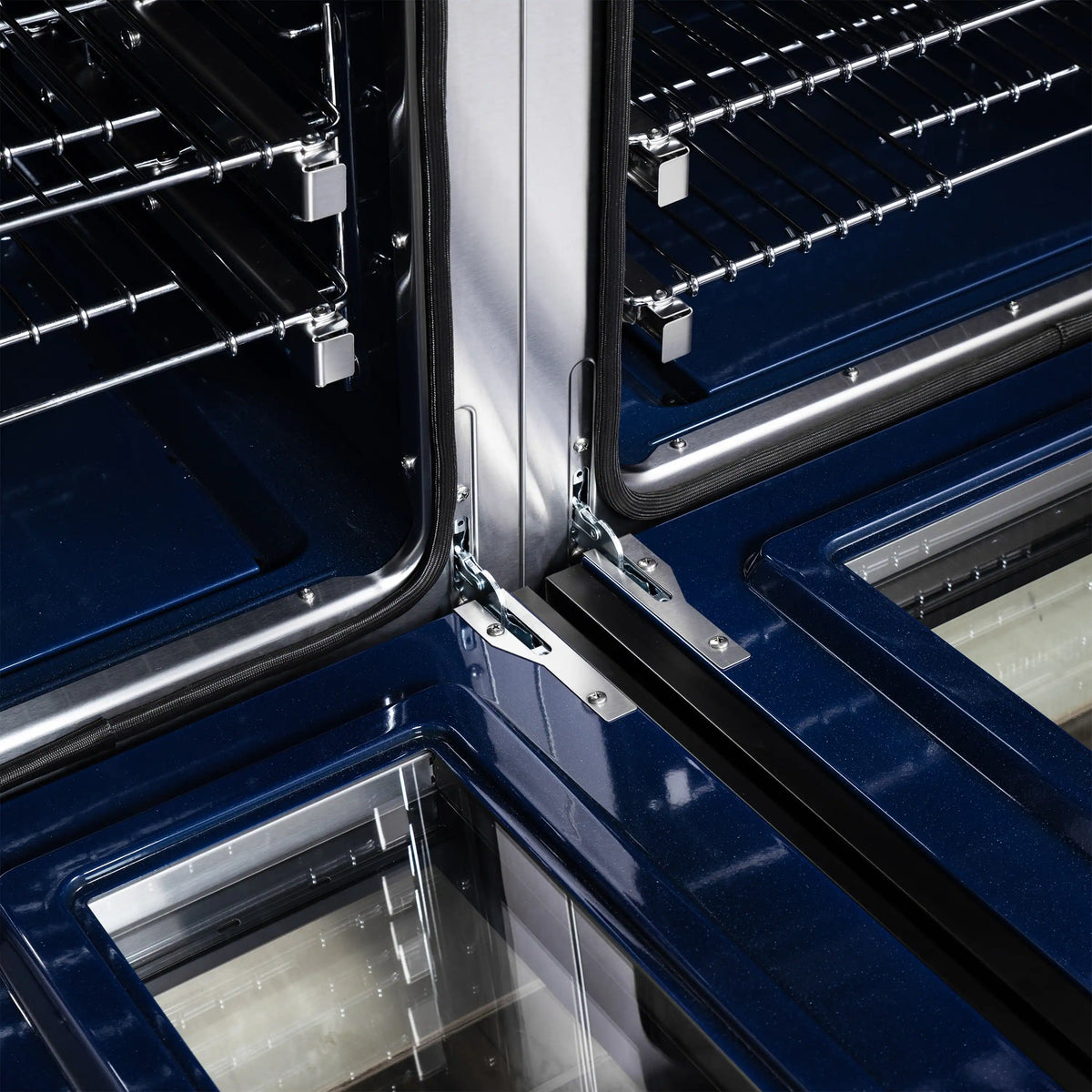 Convection oven interior close-up with metal racks, heating elements, and blue enamel