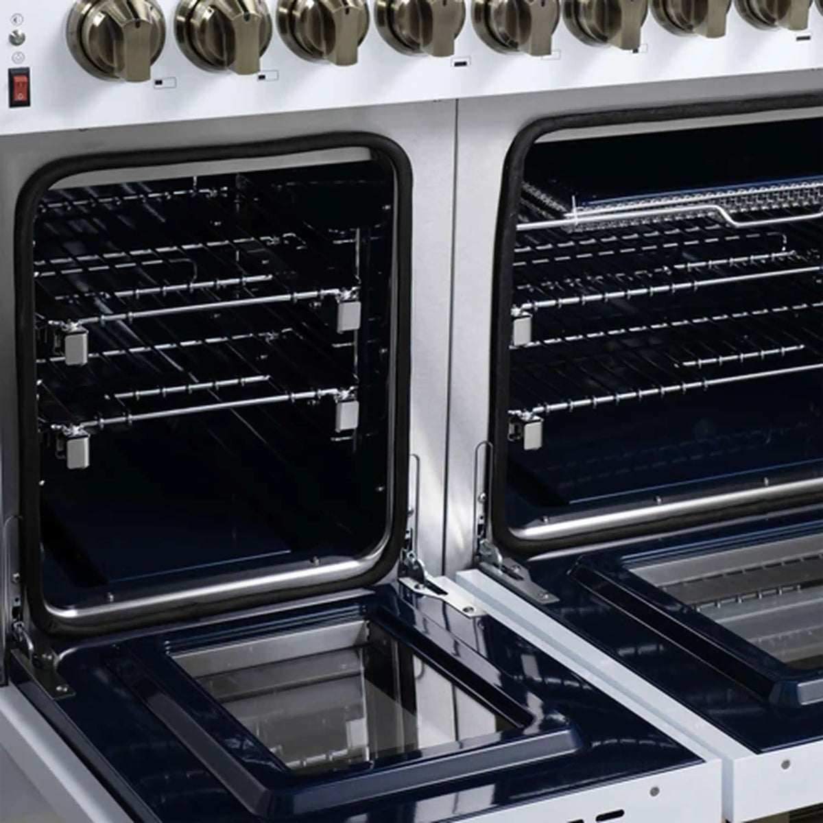 Close-up of dual fuel range oven interior with black racks and stainless rails