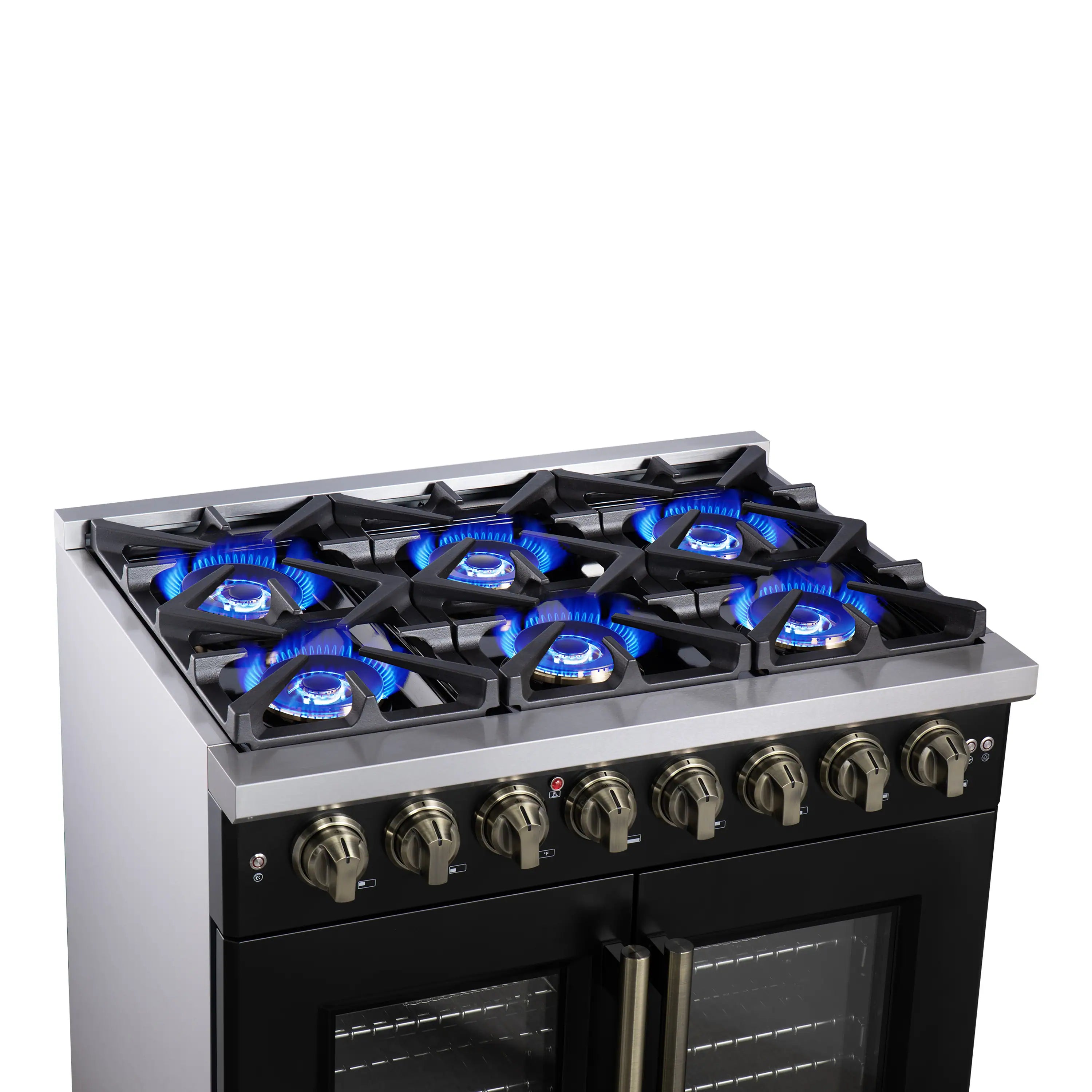 Black dual fuel range cooktop with lit blue burners and brass control knobs