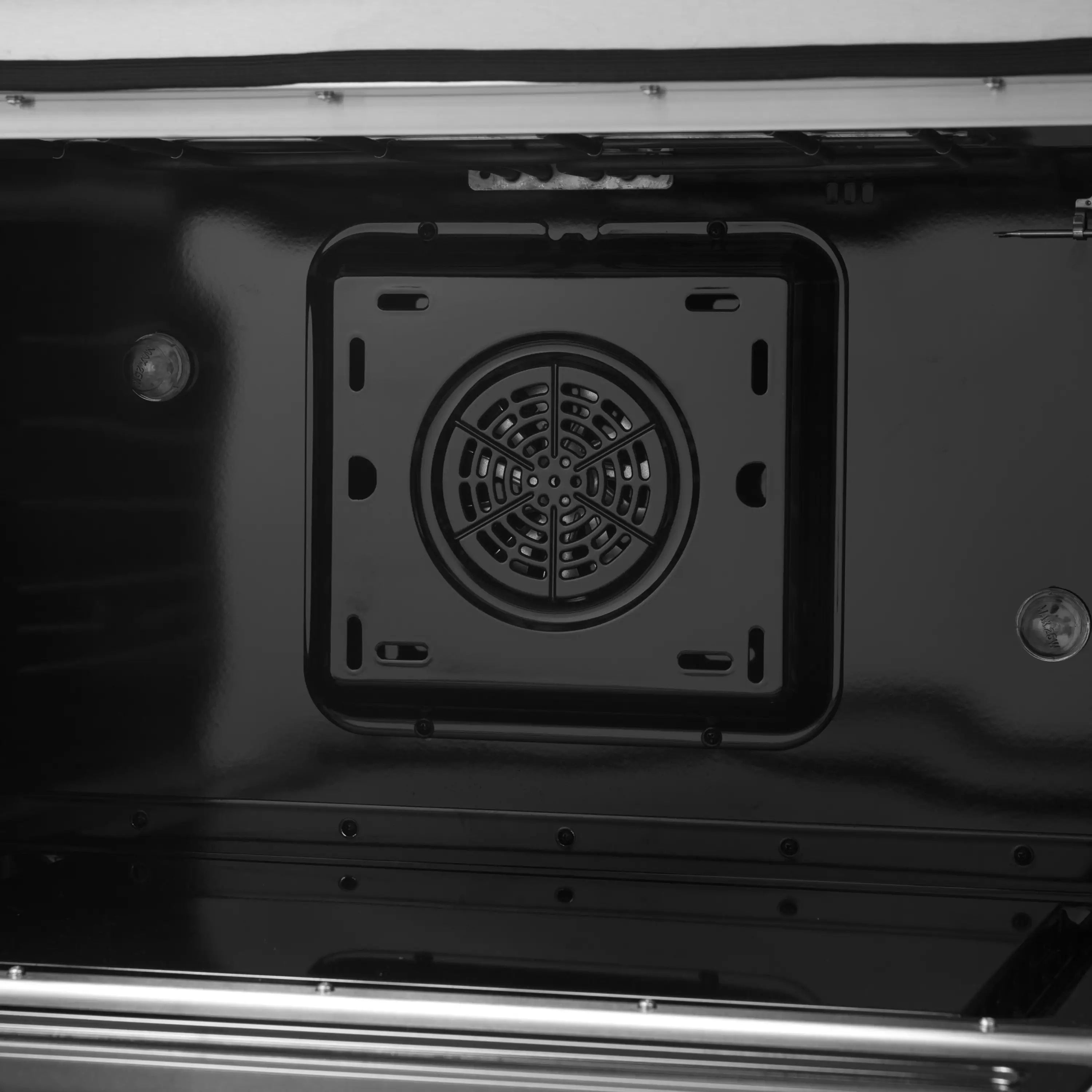Close-up of convection fan vent in black dual fuel range oven interior