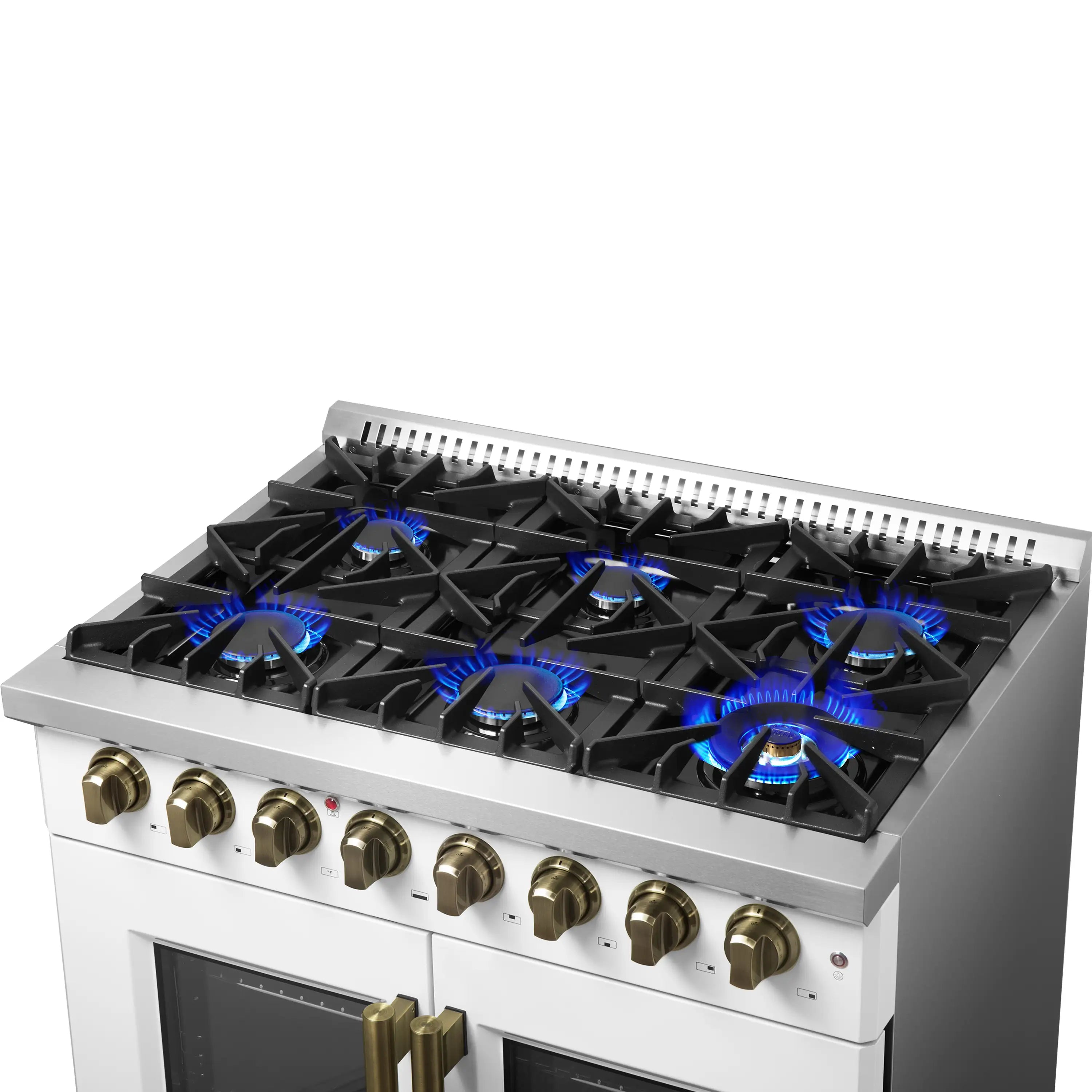 White range cooktop with lit blue gas flames and brass burner control knobs