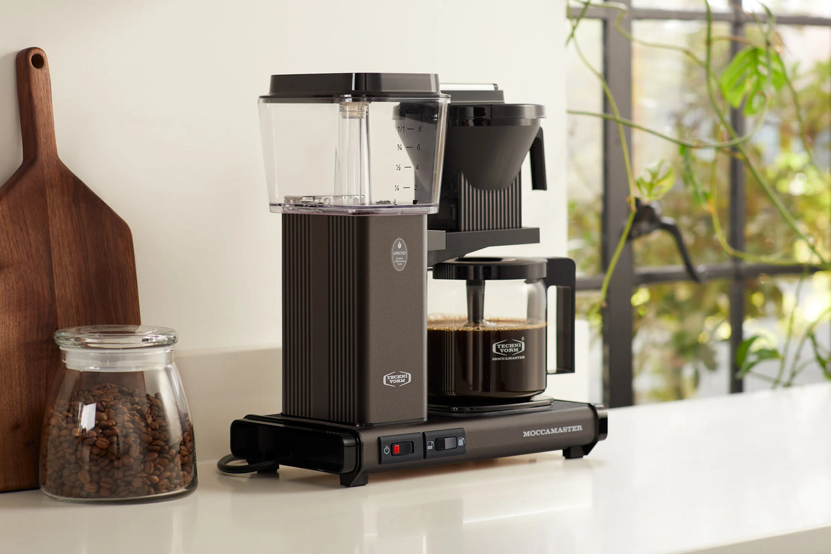 10-cup drip coffee maker with glass carafe, dark cocoa body and black top funnel