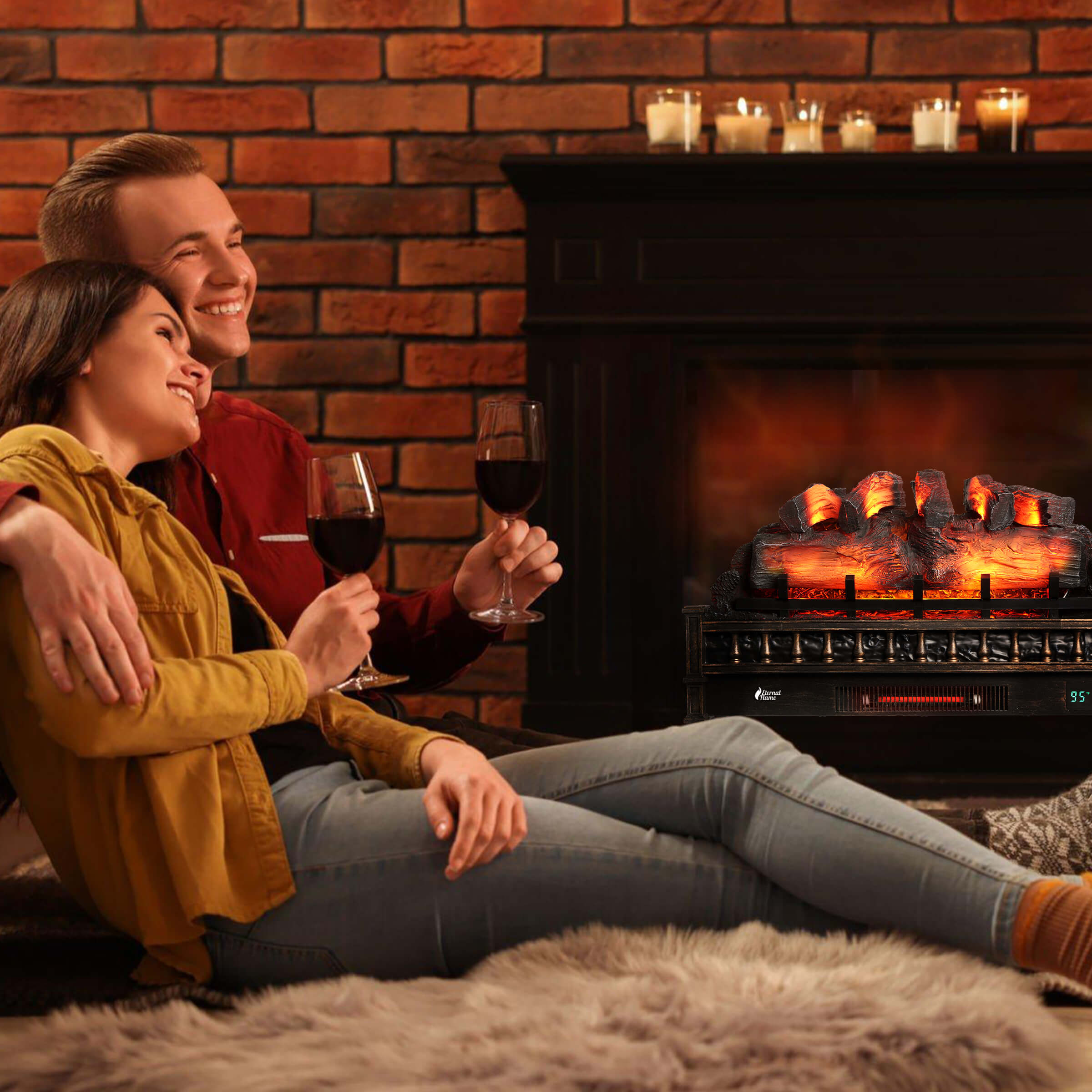 Electric fireplace in use with glowing logs behind two people on a couch