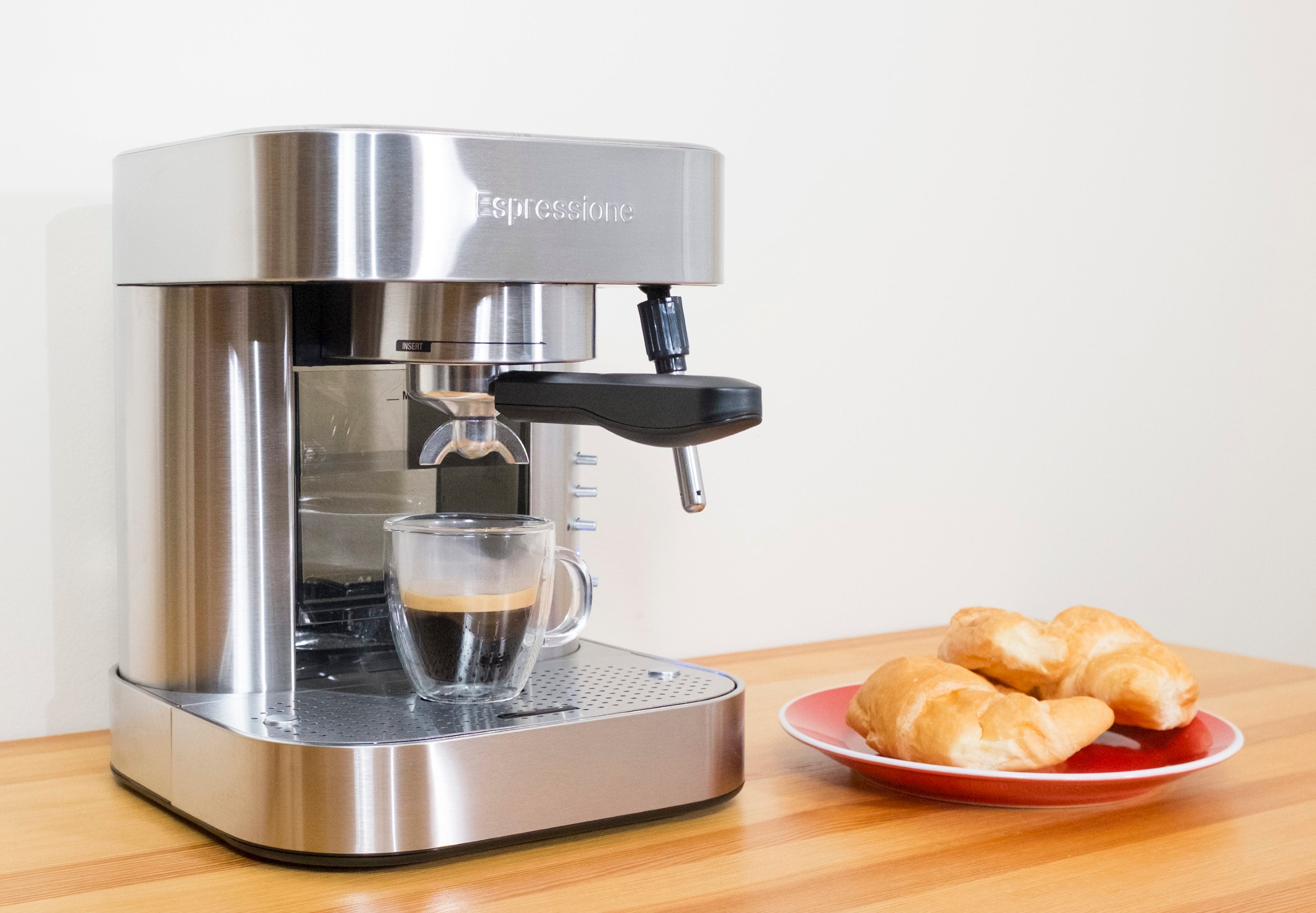 Espressione stainless steel espresso machine with glass cup under nozzle