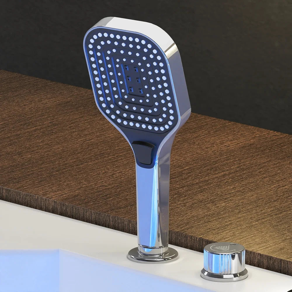 Chrome handheld showerhead with blue-lit massage jets on a white whirlpool tub