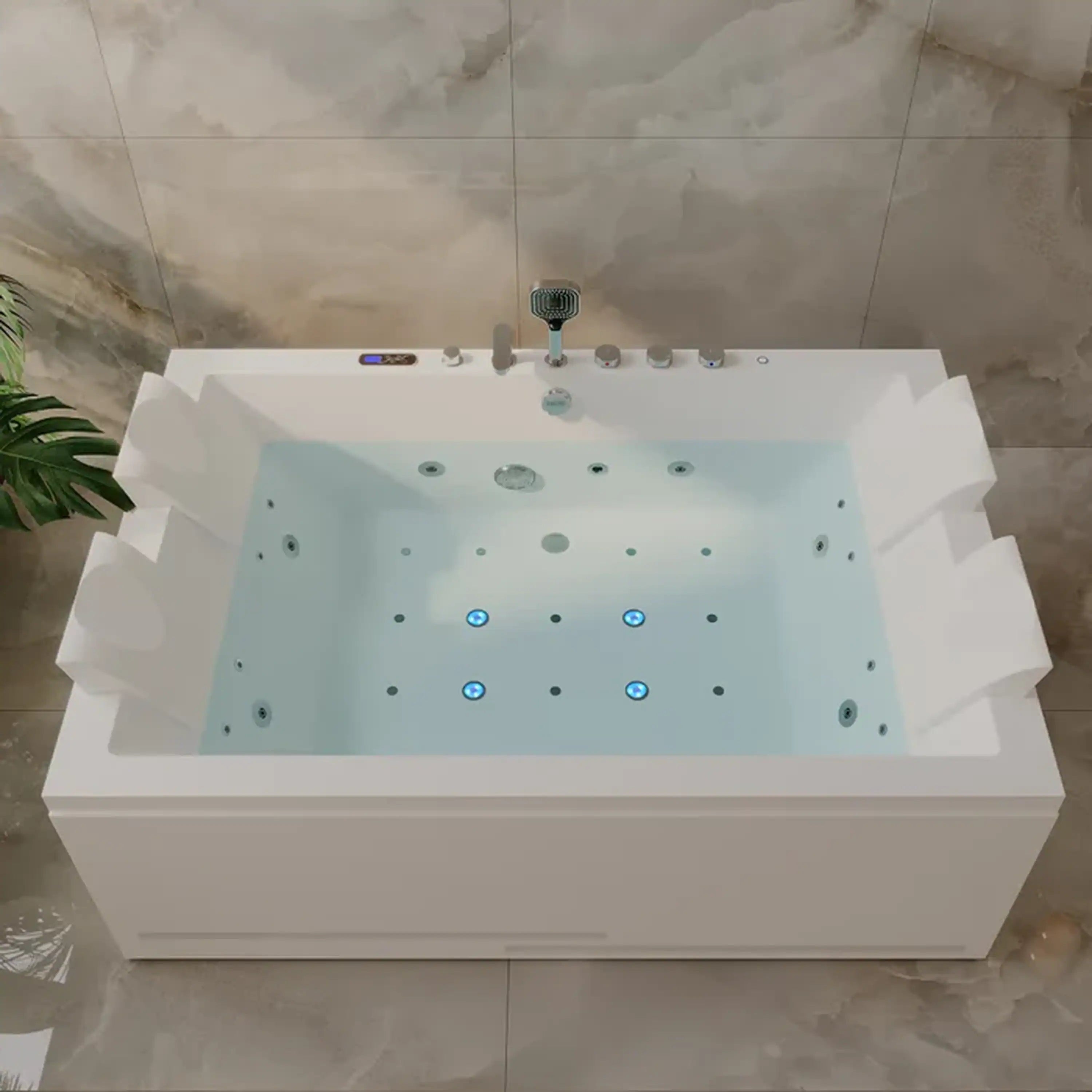 White 2-person whirlpool bathtub with jet openings, faucet controls, and headrest panels