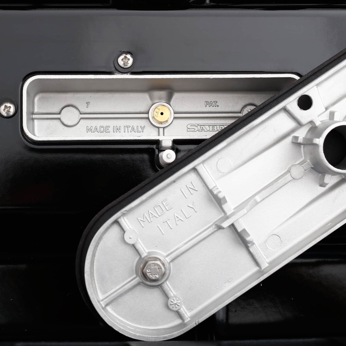 Gas range regulator cover with Made in Italy label and stamped markings