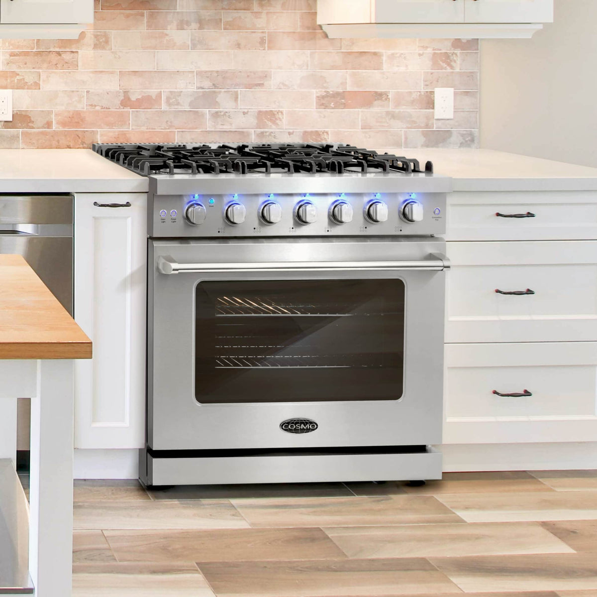 Stainless steel 36-inch gas range in kitchen with oven door and front controls