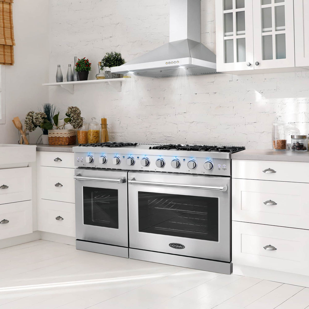 Stainless steel double oven gas range in white kitchen, with two oven doors and burner controls