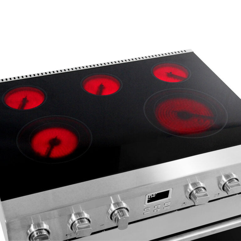Electric range cooktop with four glowing red heating elements and silver knobs