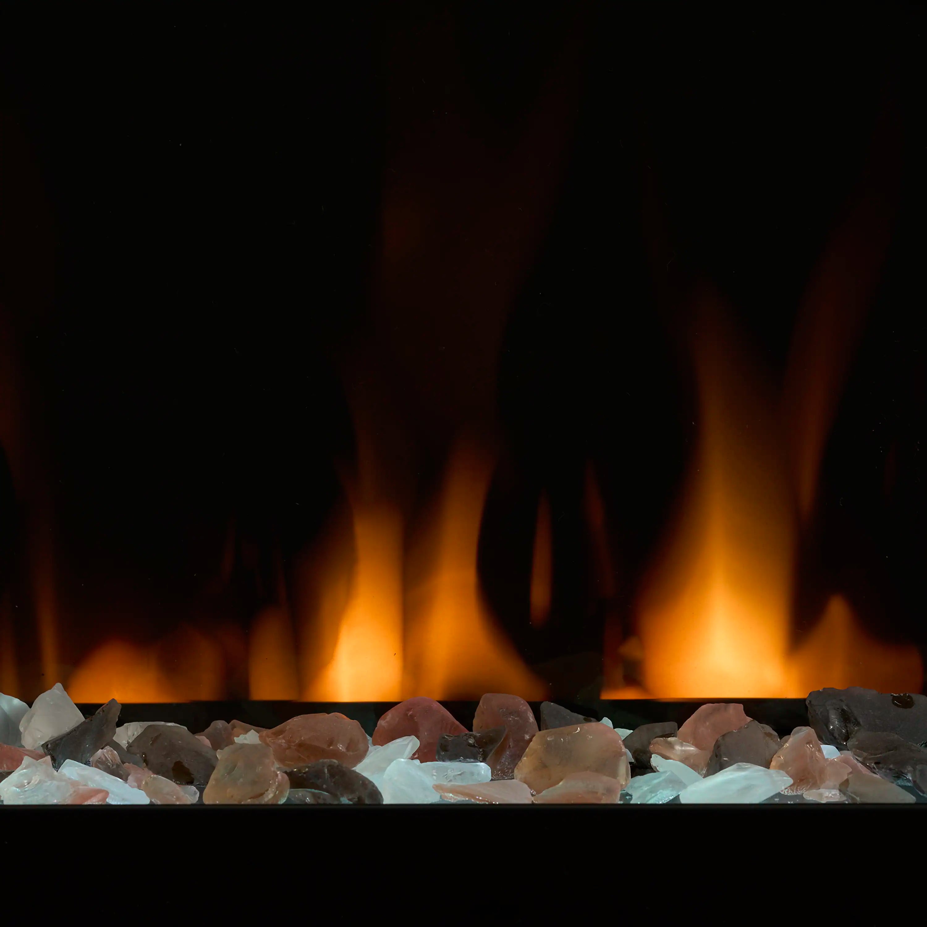 Electric fireplace ember bed with blue glass rocks and orange flames in the back