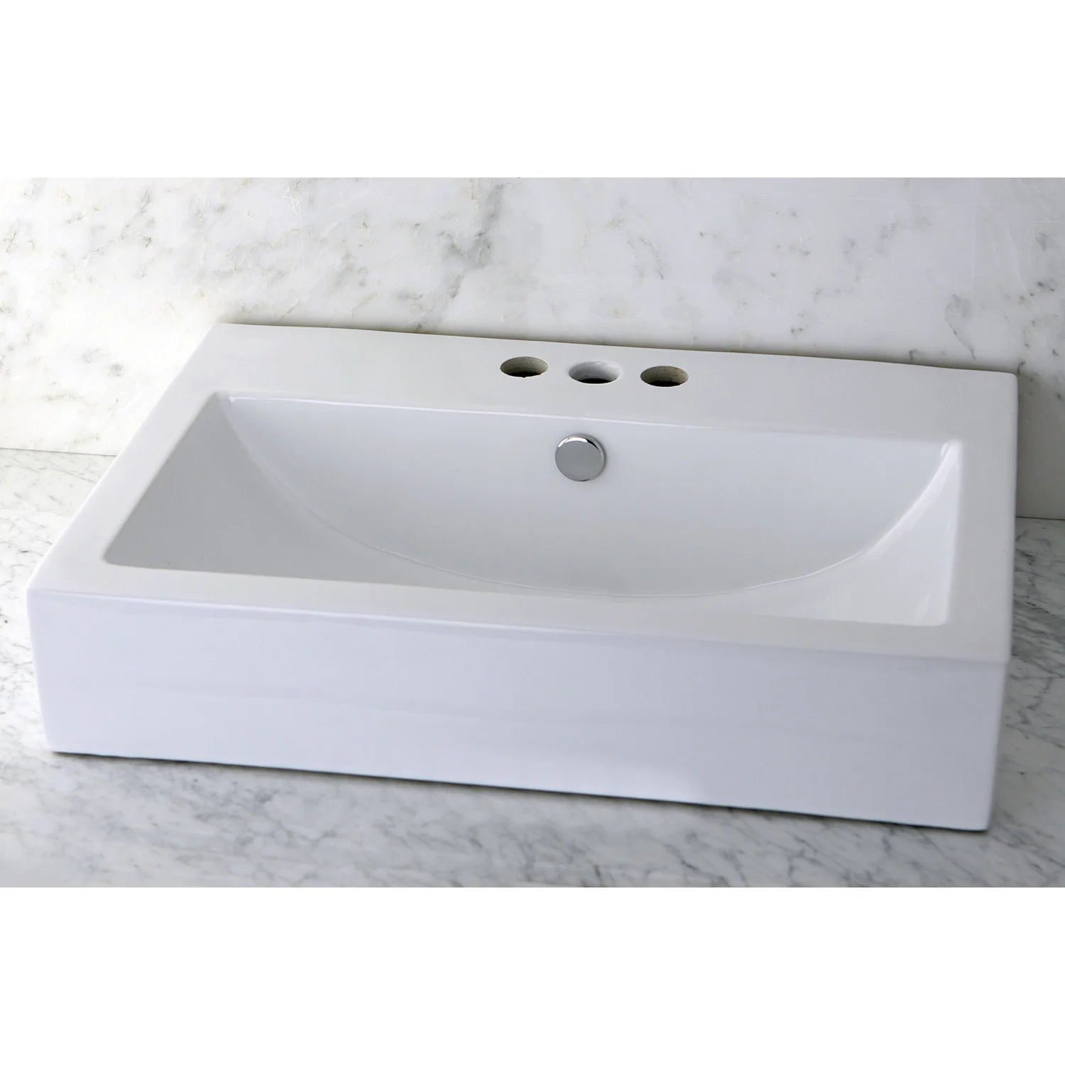 White rectangular ceramic bathroom sink with center drain and 3 top faucet holes