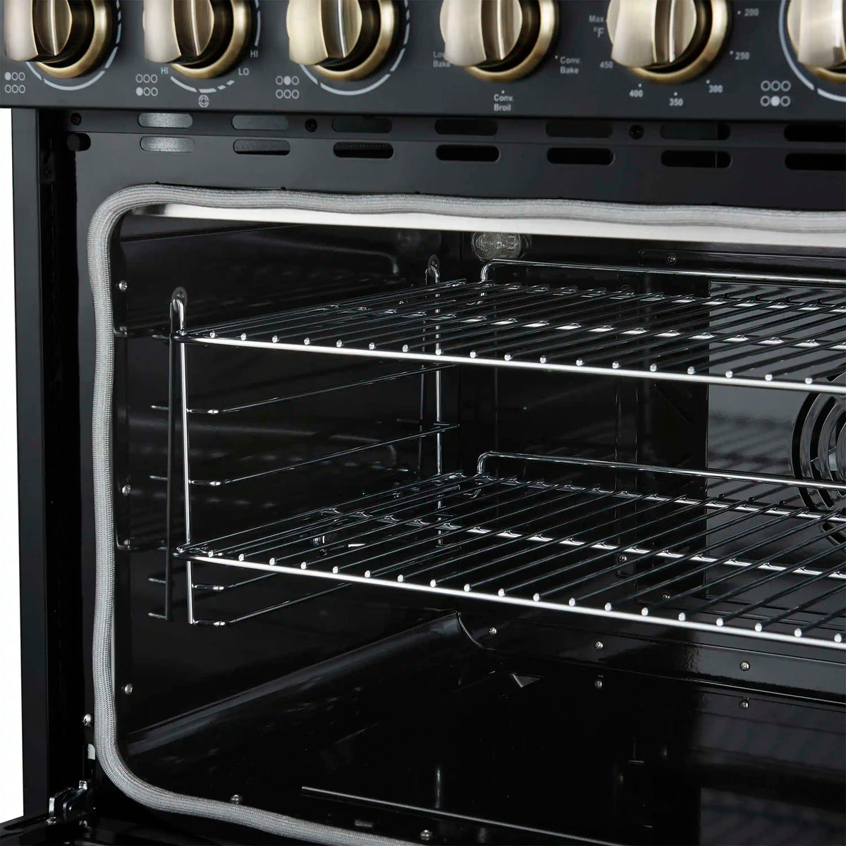 Freestanding electric range oven door open, showing wire racks and convection fan