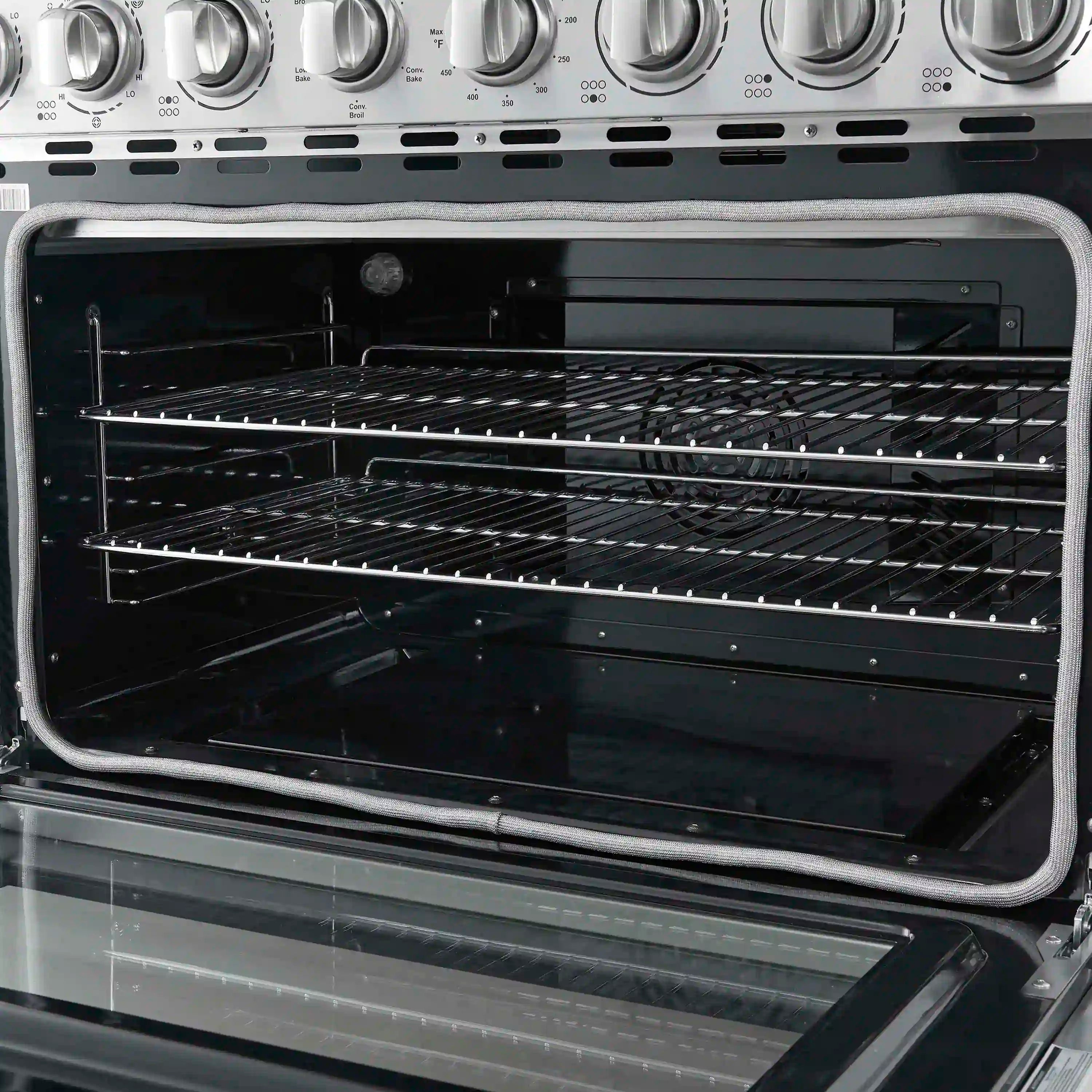 Stainless steel electric range oven interior with racks and heating elements visible