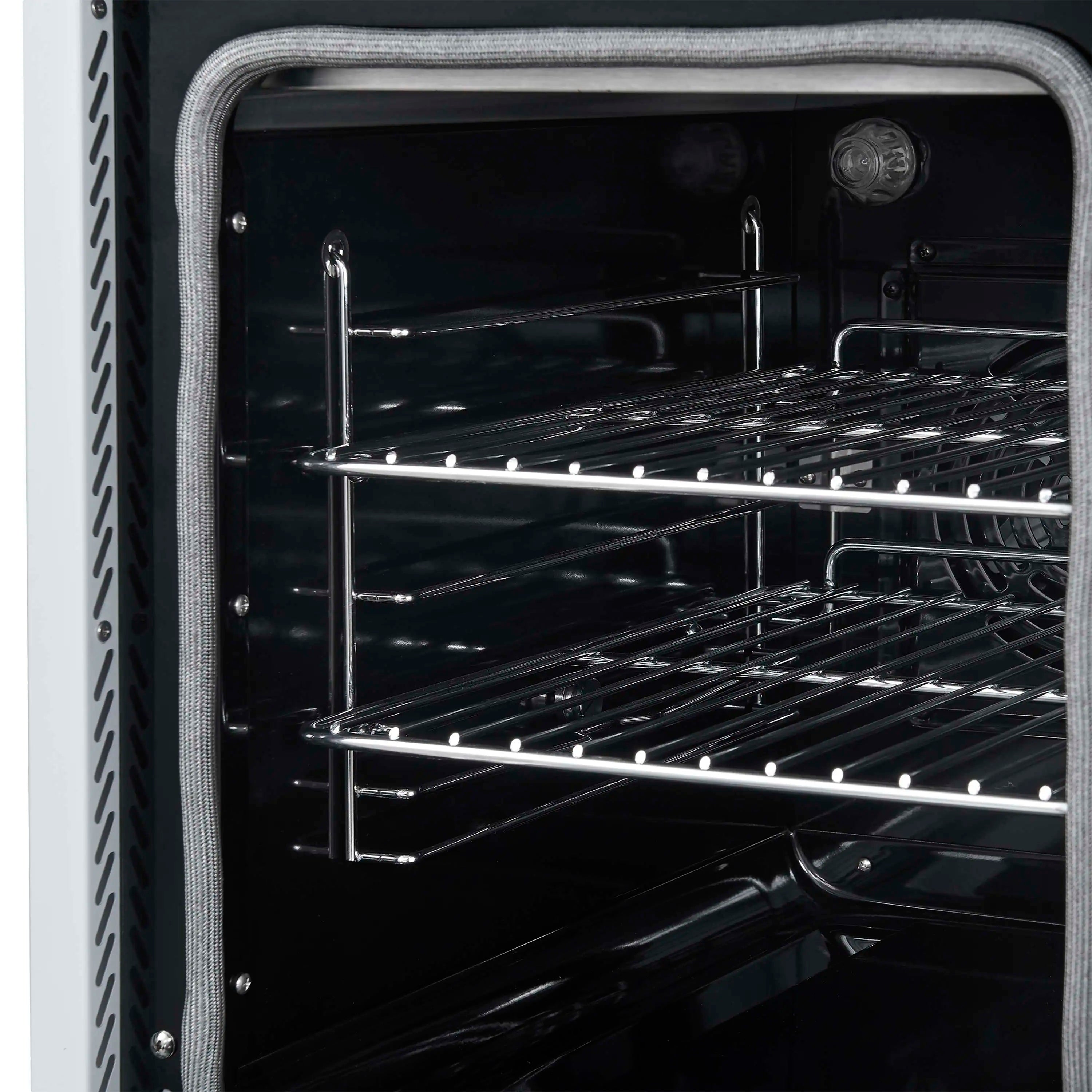 White electric range oven interior with multiple wire rack levels