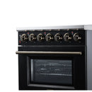 Front view of black electric range with burner knobs and oven door window