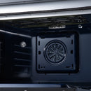 Black oven interior with circular convection fan and vent cover