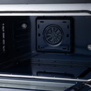 Black oven rear wall with circular convection fan and metal oven walls