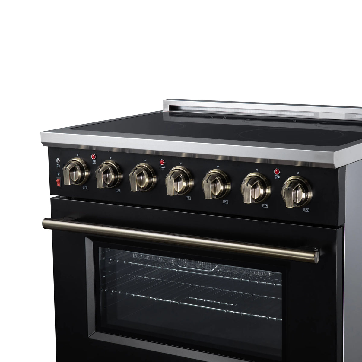 Close view of black oven and stainless handle with brass burner control knobs
