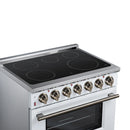 White electric range top with black glass cooktop burners and oven door with control knobs