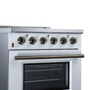 White freestanding electric range with brass-tone control knobs and black oven window