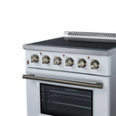 White freestanding electric range front with brass-tone burner knobs and oven door handle