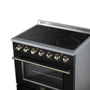 Freestanding electric range with black cooktop, brass knobs, and oven door handle