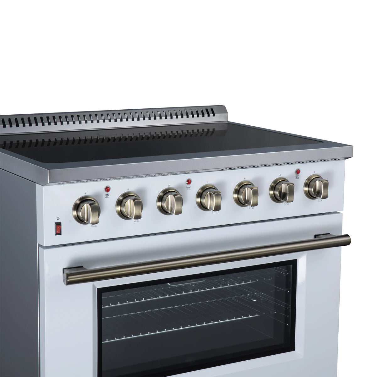 White electric range top controls with brass-toned knobs and oven viewing window