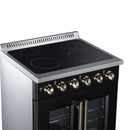 Black electric range with glass radiant cooktop, brass knobs, and dual oven doors