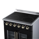 Black electric range with radiant cooktop and brass control knobs, French-door ovens