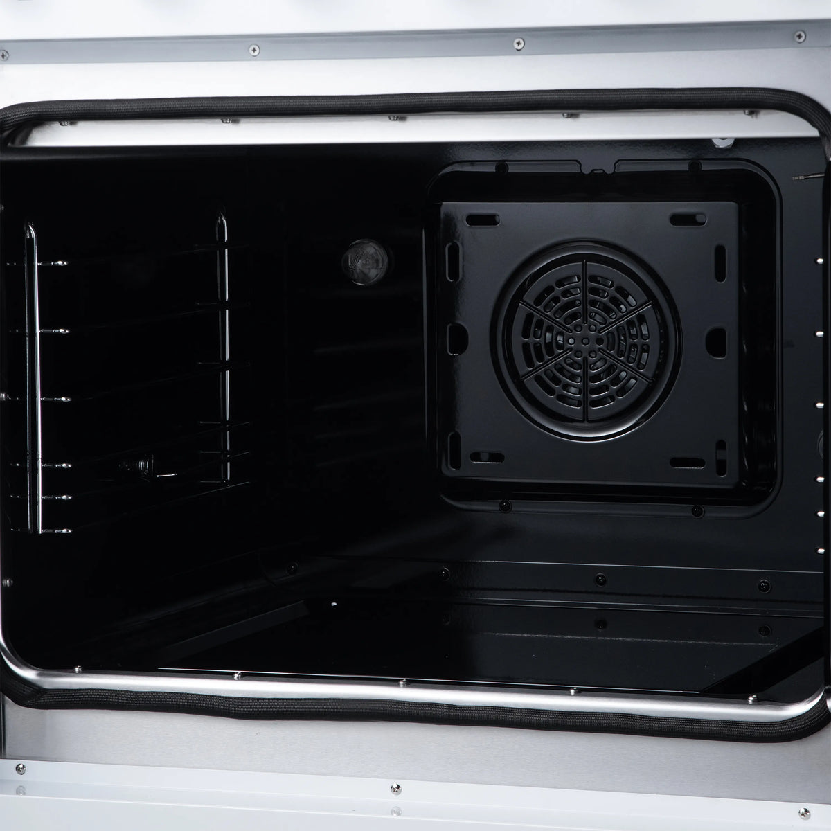 Open oven with black fan housing and side rack guides