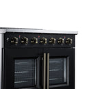 Black electric range with brass control knobs and dual French oven doors