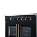 Black electric range with brass center handle and two glass oven doors