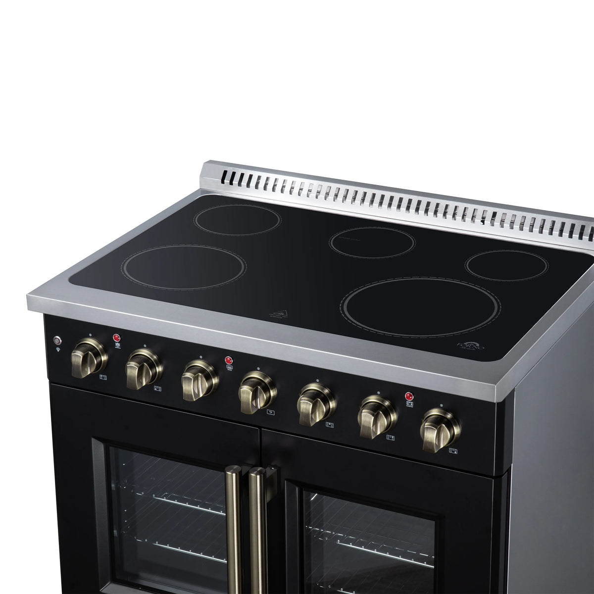 Black electric range cooktop with radiant burner circles and row of brass control knobs