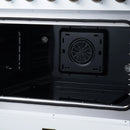 Black electric oven cavity with circular fan vent opening and side rack guides