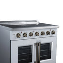 White electric range control panel with brass-finish knobs and two oven doors