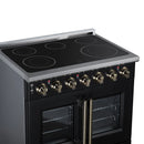 Black electric range with radiant cooktop and open double oven doors with stainless trim