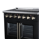 Black electric range front with six radiant burner knobs and two oven doors
