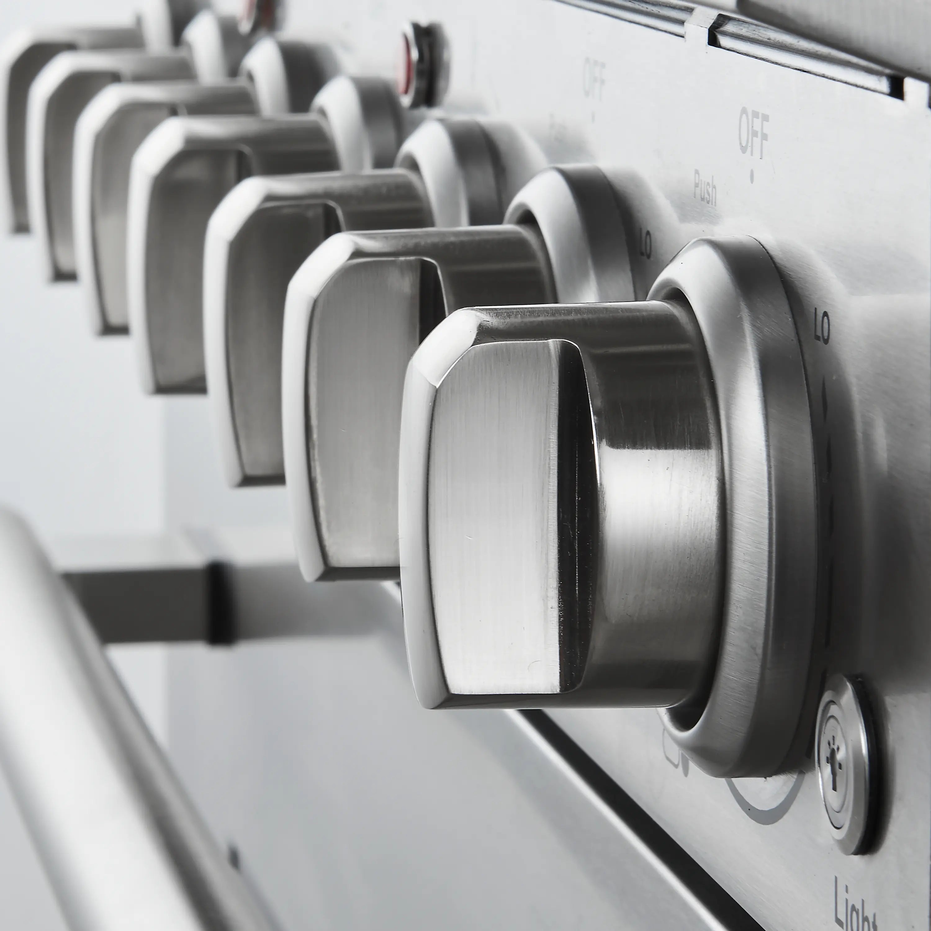 Stainless steel electric range control knobs with OFF markings