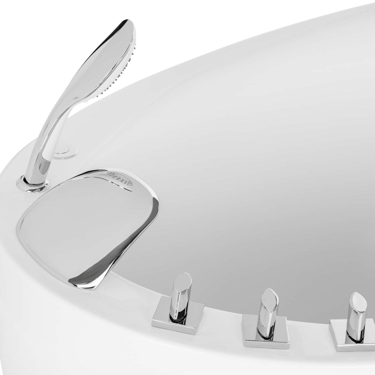 Chrome faucet and deck controls on a white freestanding air bathtub rim