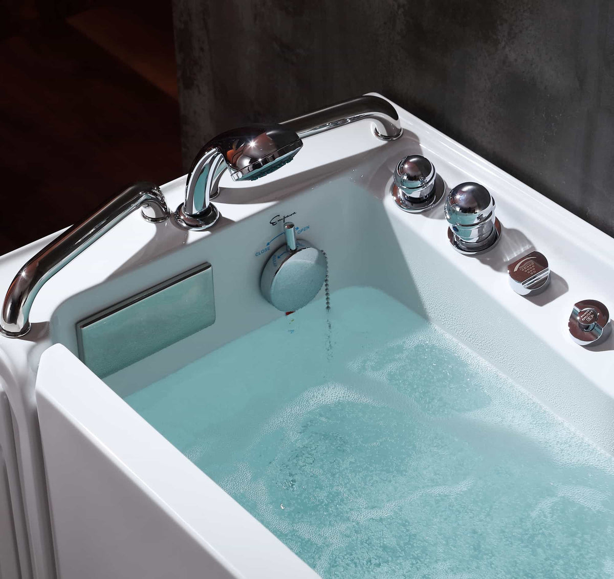 53-inch walk-in whirlpool bathtub, close-up of chrome controls and turquoise water