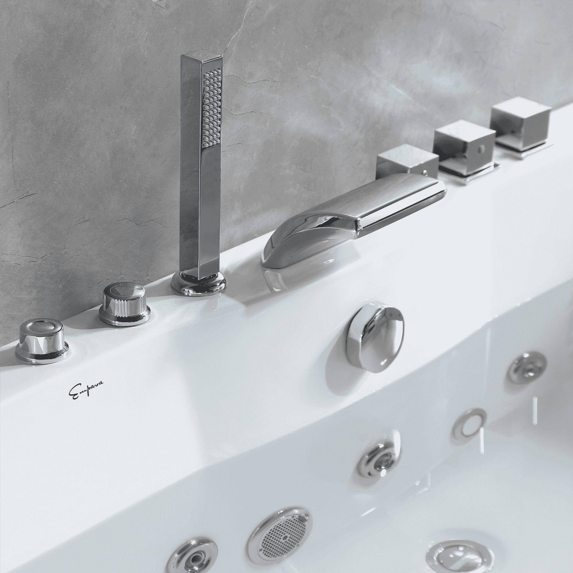 Chrome faucet and digital controls on a white whirlpool bathtub