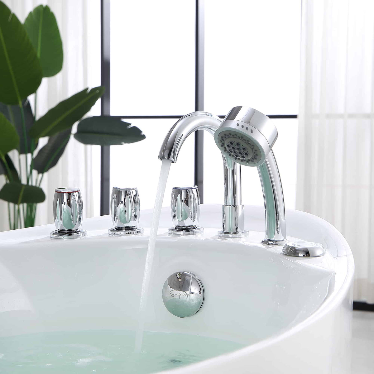 Chrome whirlpool bathtub faucet set with handheld shower and white acrylic tub rim