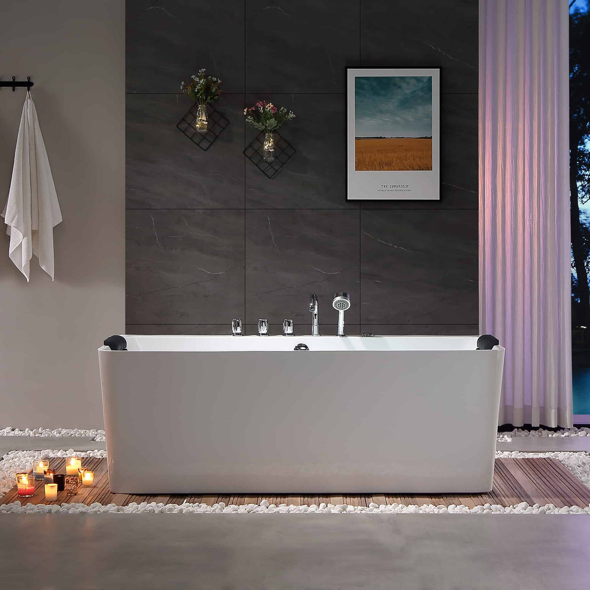 Freestanding white acrylic whirlpool bathtub with chrome faucet and centered control