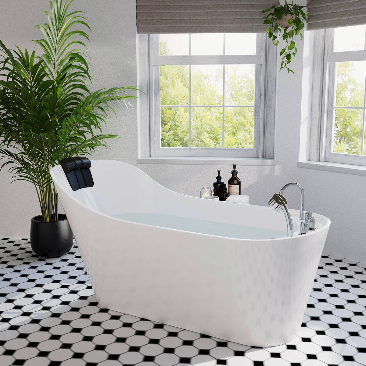 White freestanding acrylic whirlpool bathtub with built-in headrest and chrome faucet.