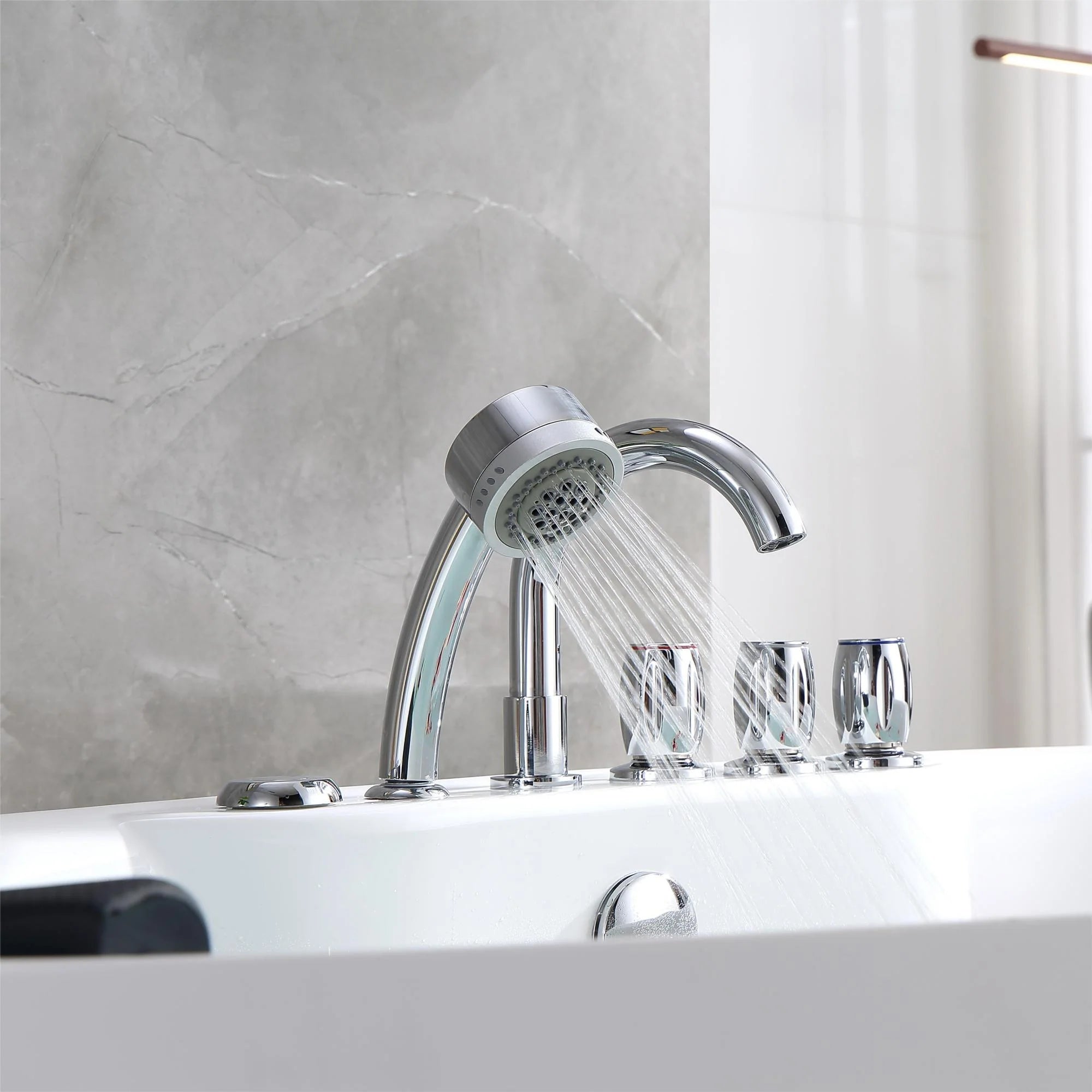 Chrome bathtub faucet with handheld shower head over a white acrylic tub